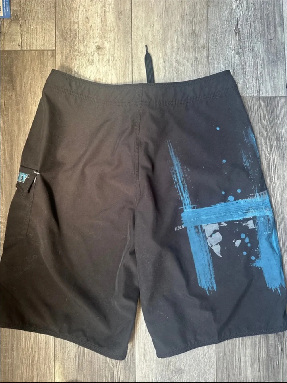 06 vintage Oakley Black Board Shorts with Blue Graphic Accents